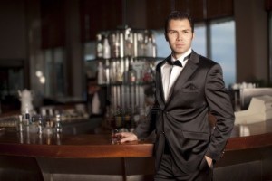 6378265-handsome-young-man-in-a-black-tuxedo-at-a-round-bar-holding-whisky-in-his-hand-shallow-depth-of-fiel